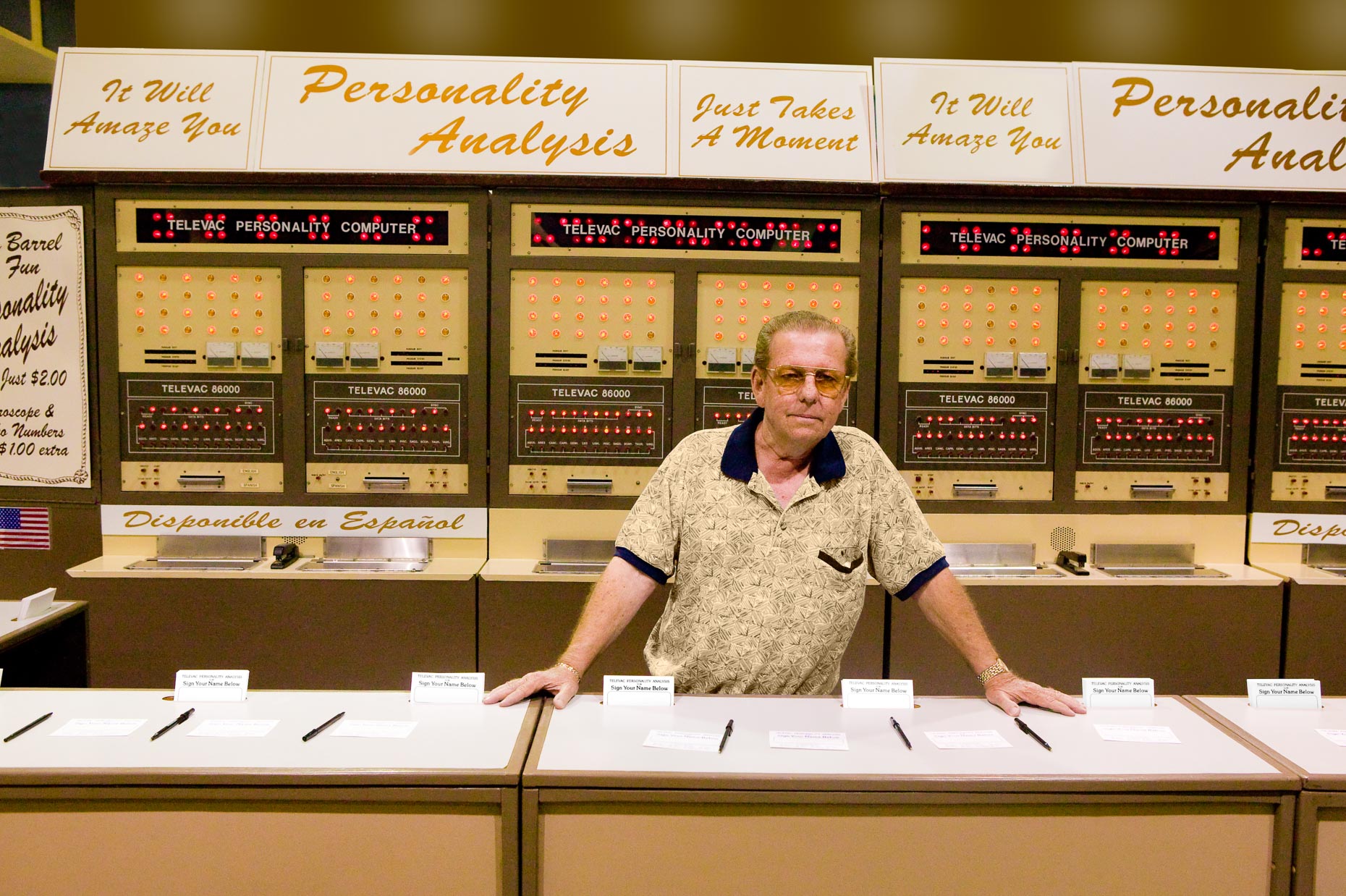 Man standing at counter in front of personality analysis machine computer at Los Angeles County State Fair by David Zaitz