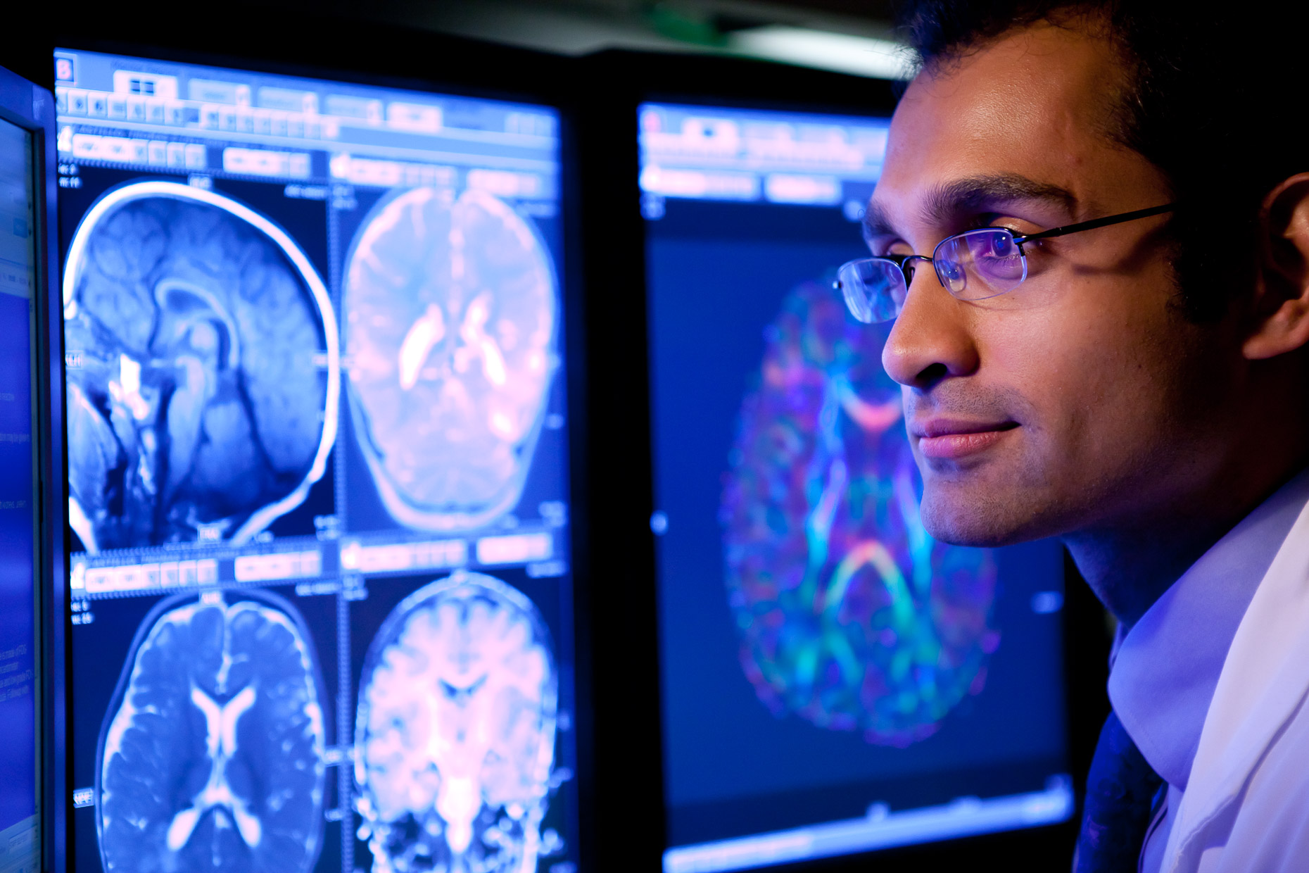 Doctor looking at medical body scans on computer screen in hospital. Medical, healthcare. David Zaitz Photography.