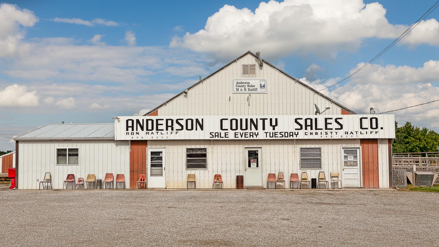 Chairs in front of ANDERSON COUNTY SALES CO. building by David Zaitz