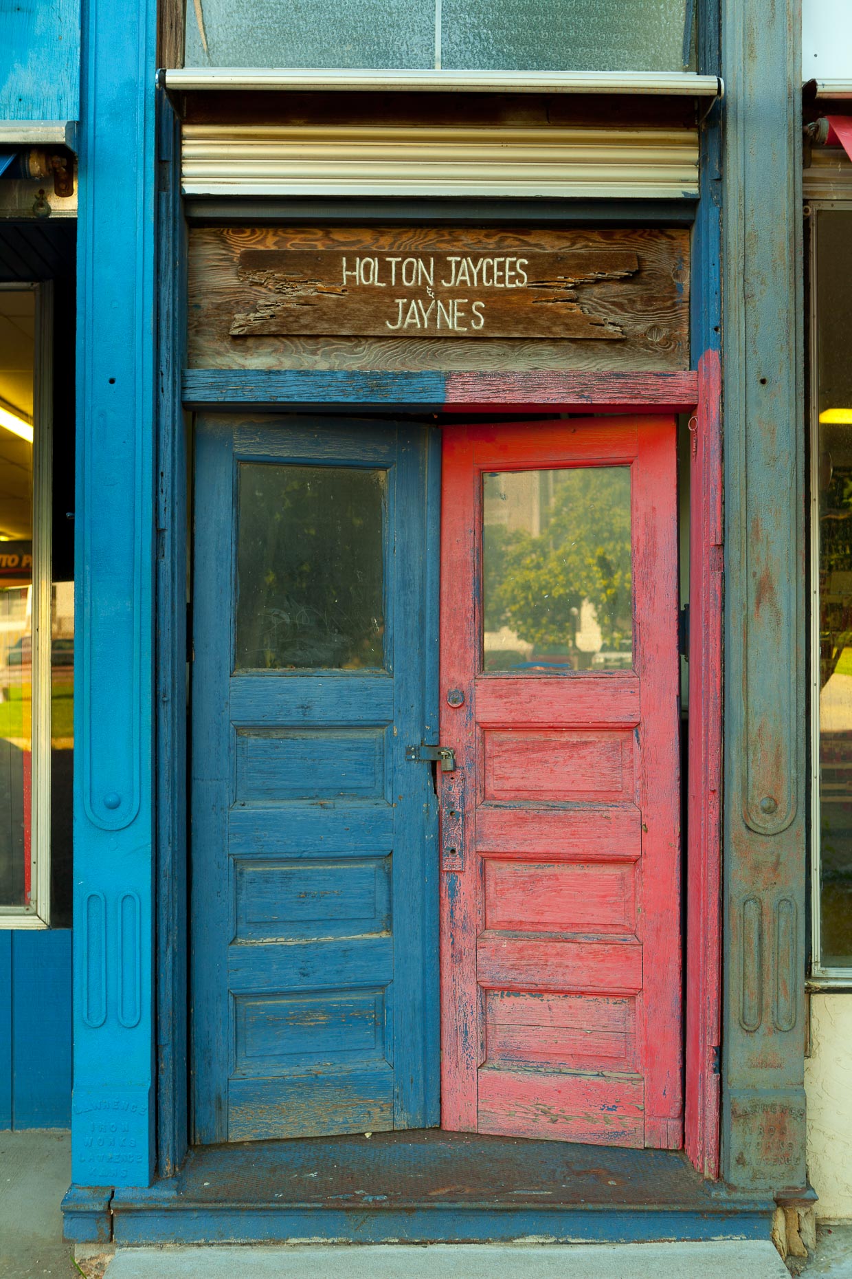 Blue and red doors on old building by David Zaitz