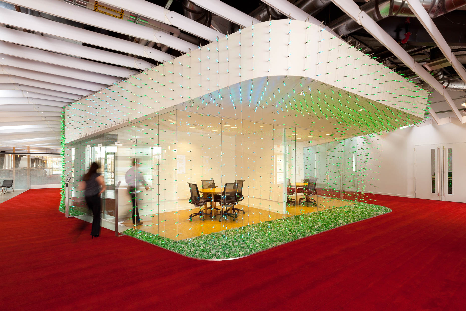 Modern architecture glass walled meeting room with green lights at Claremont University Consortium, Claremont College, California. David Zaitz Photography.