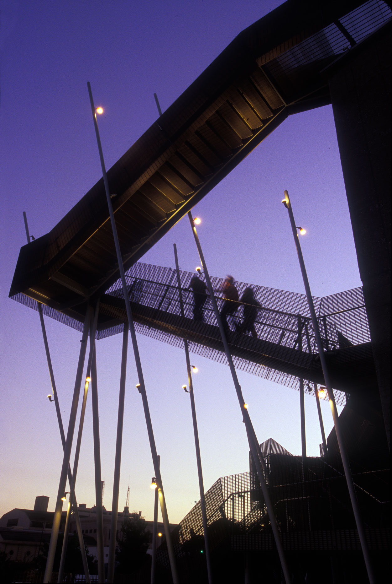 People walking on exterior building staircase silhouette against dusk sky at Art Center College of Design in Pasadena, California. Architecture.  David Zaitz Photography.