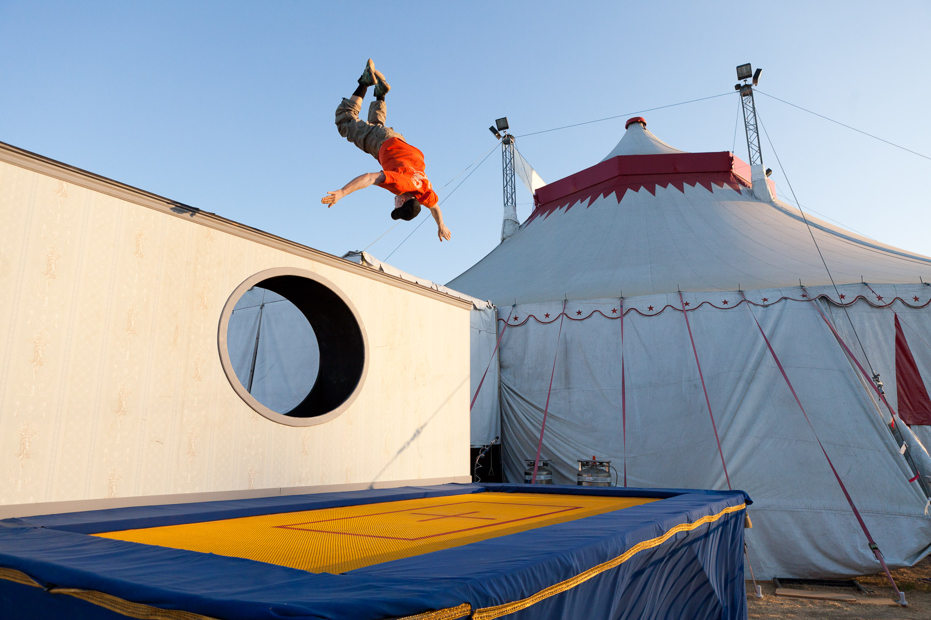 Performer flipping upside down at Cirque Berzerk circus performers, by David Zaitz