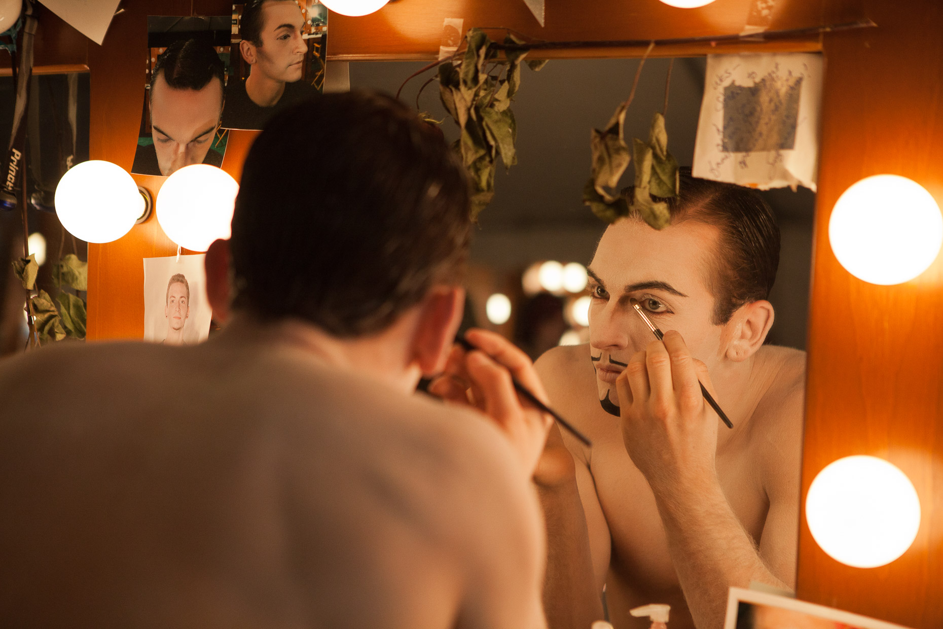 Performer applying makeup at Cirque Berzerk circus performers, by David Zaitz