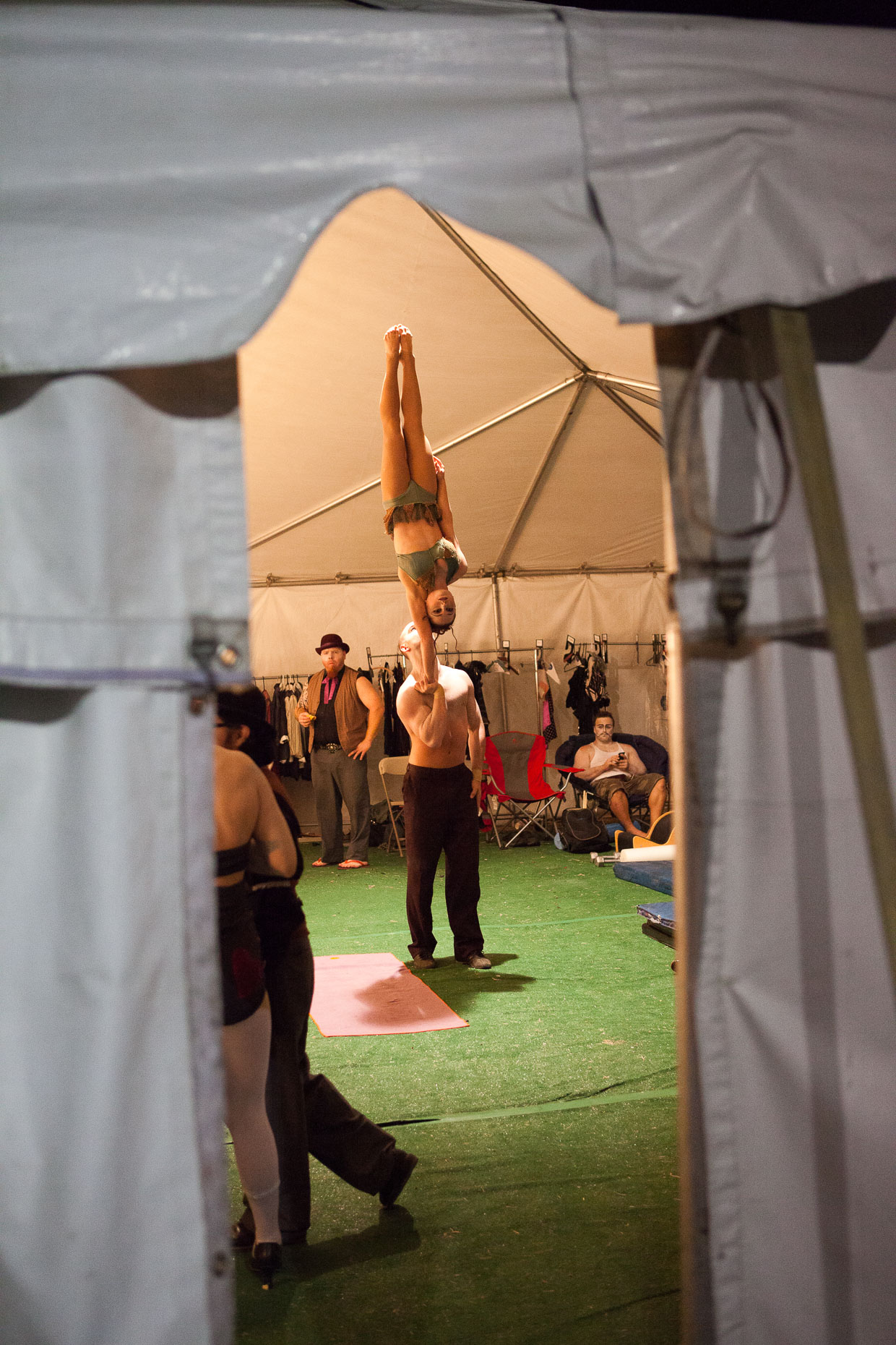 Performers practicing balance at Cirque Berzerk circus performers, by David Zaitz